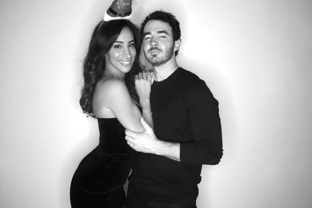 Couple posing for a black-and-white glam booth portrait at a New Jersey event
