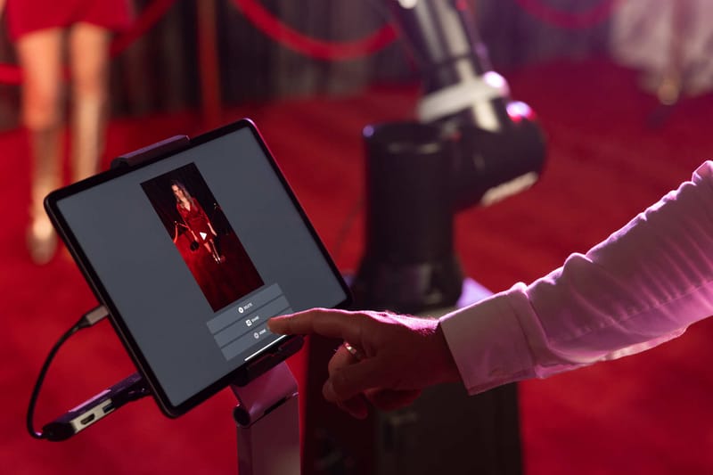 Glambot robotic arm set up on a red carpet at an New Jersey venue — photo 1