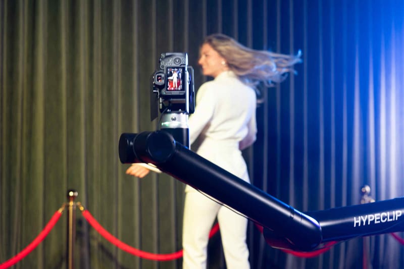 Guest posing for a slow-motion Glambot clip at a New Jersey event — photo 2